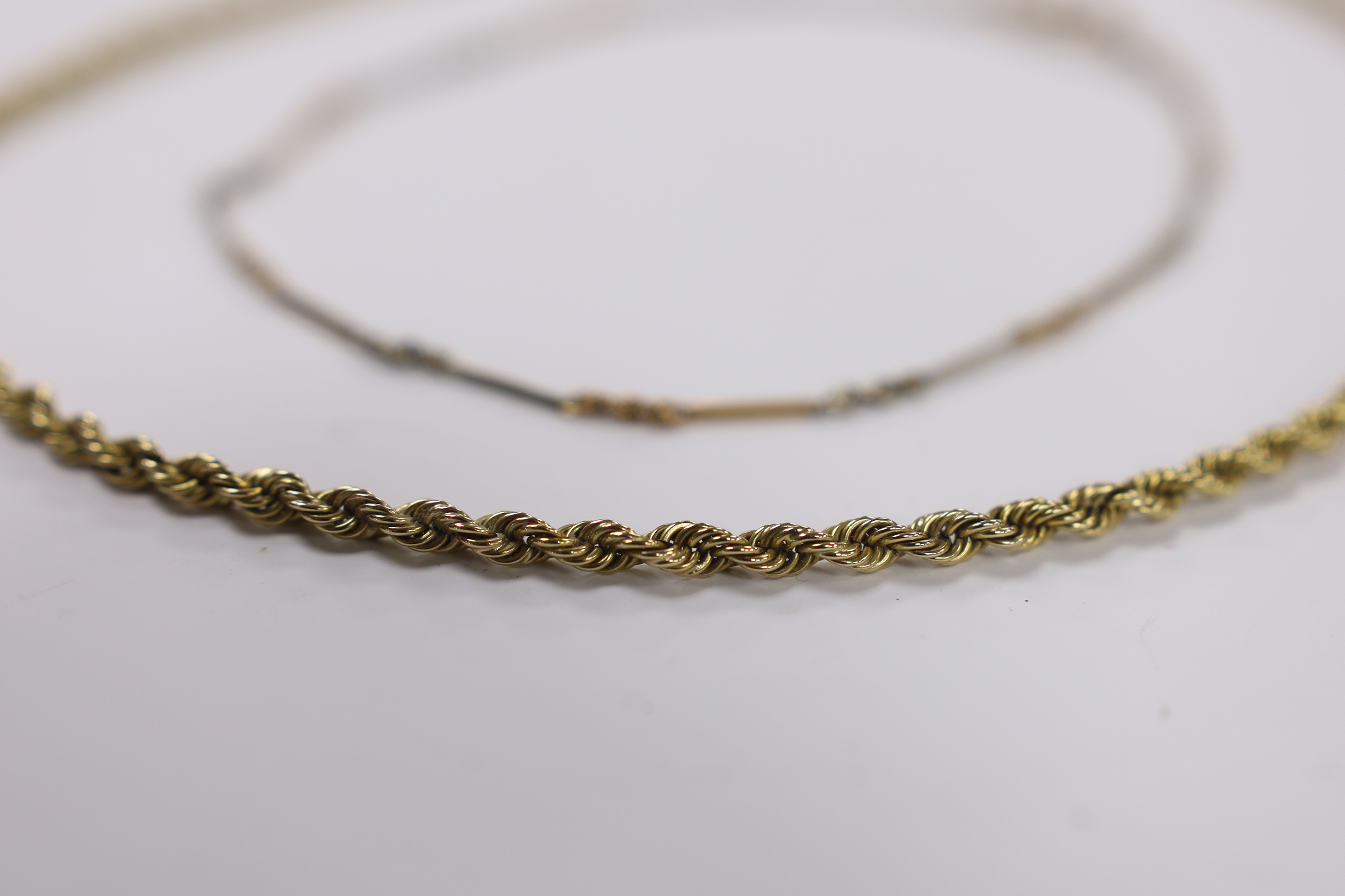 A 9ct gold rope twist chain, 50cm, together with a small 9ct albertina